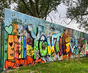 A colourful graffiti art design on a wall in Ollerton