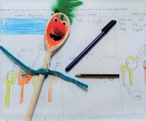 A wooden spoon puppet on a storyboard worksheet