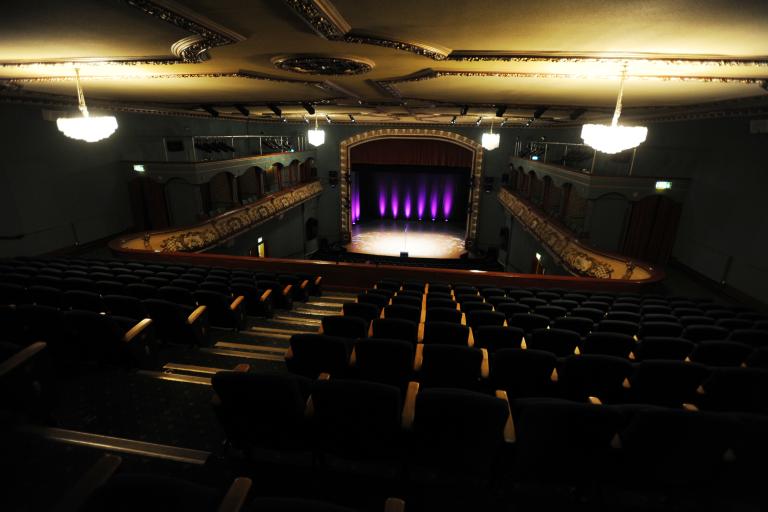 View of the Palace Theatre auditorium and stage from the upper circle seating area.