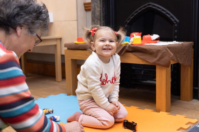 Young child playing with toys during a family-friendly Mini Museum session at the National Civil War Centre.