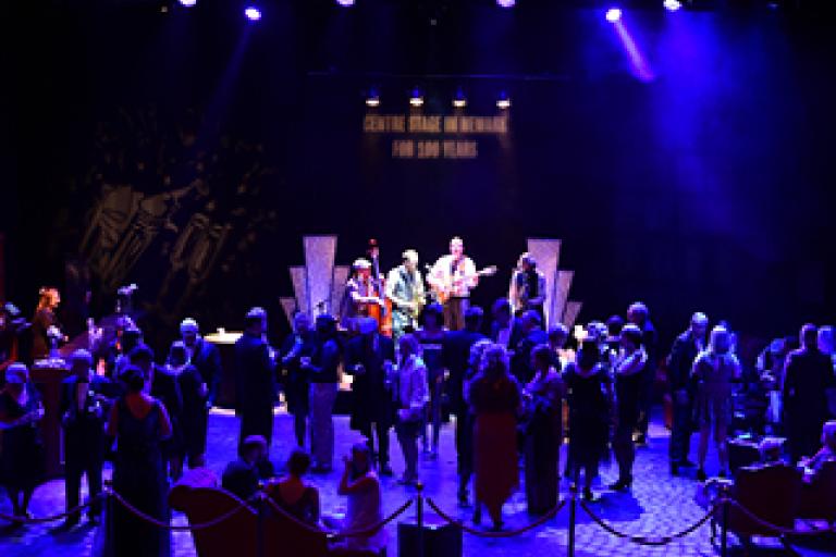 People on stage for a party 