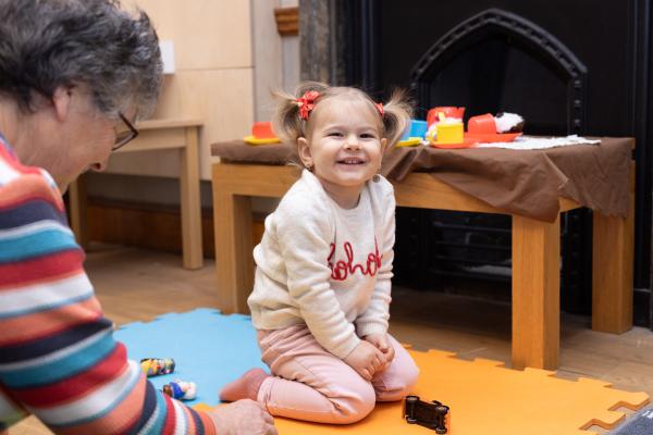 Young child playing with toys during a family-friendly Mini Museum session at the National Civil War Centre.