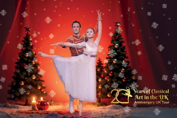 Promotional image for The Nutcracker, featuring two ballet dancers in a festive winter scene with decorated Christmas trees, candles, snowflakes and a red stage backdrop. Gold text highlights the company’s “20 Years of Classical Art in the UK” Anniversary UK Tour.