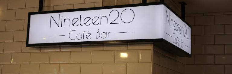 Sign in a cafe with the word Nineteen20 Cafe Bar