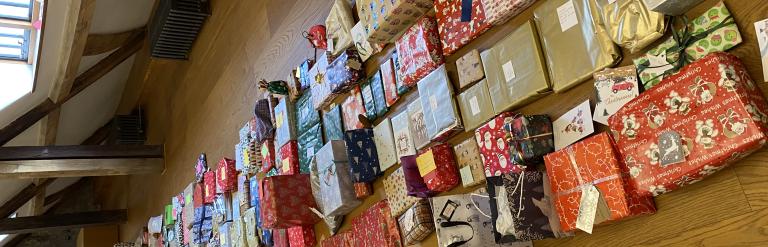 Presents lined up on a wooden floor
